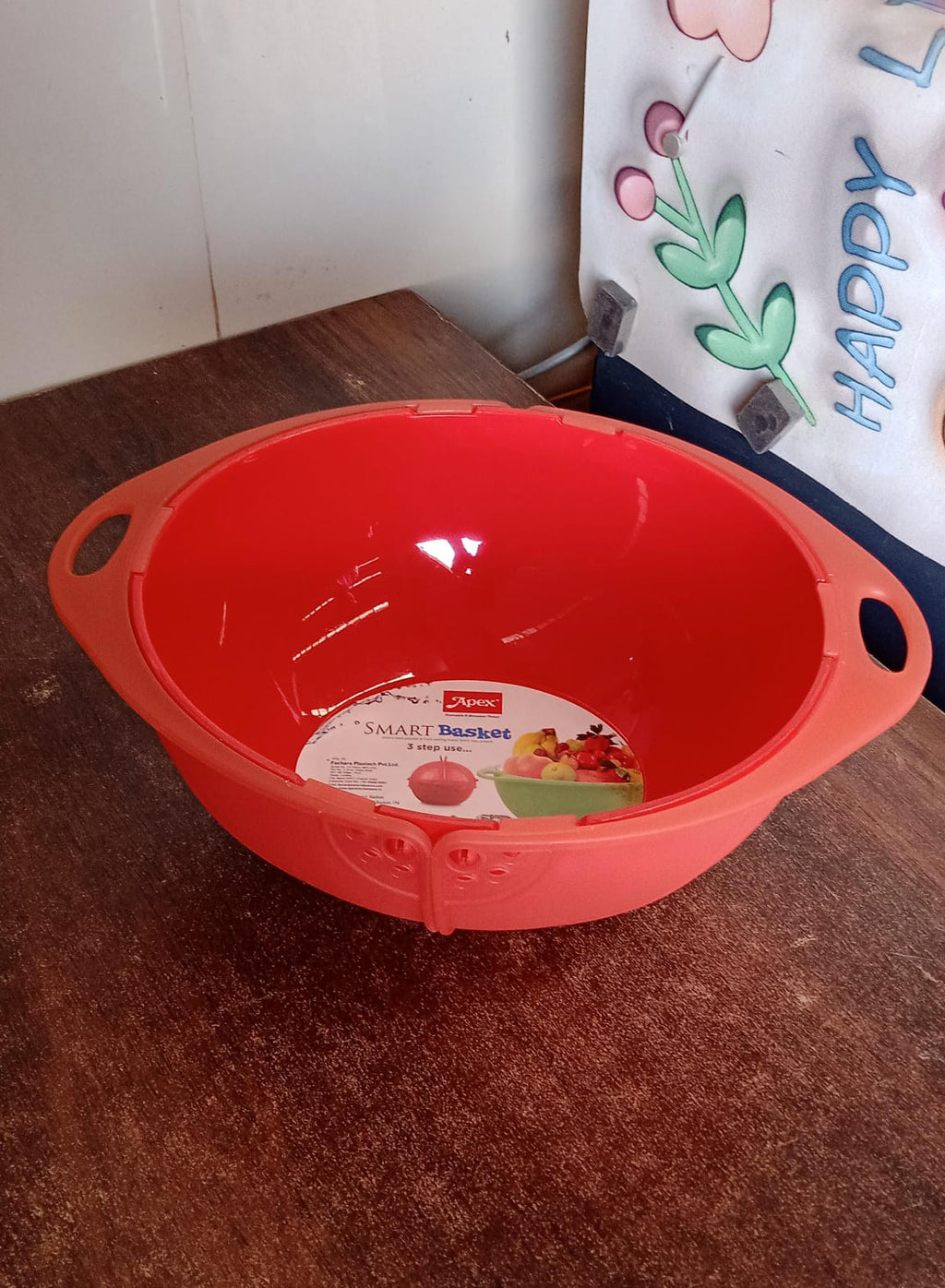 Close-up of perforated colander and storage sections in Apex Smart Basket fruit and vegetable bowl