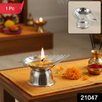 Close-up view of stainless steel agarbatti holder with diamond design