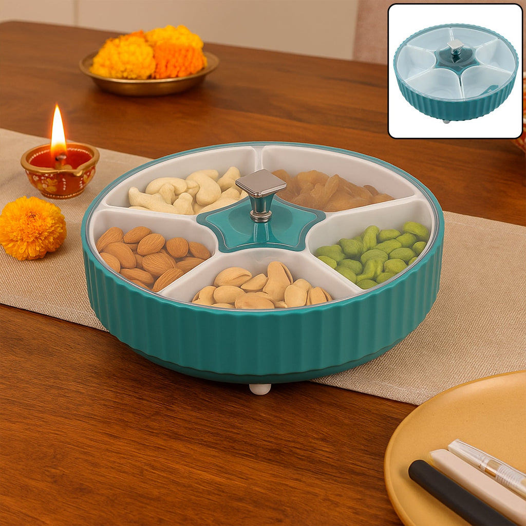 Revolving dry fruit box with seven clear compartments on a kitchen counter.
