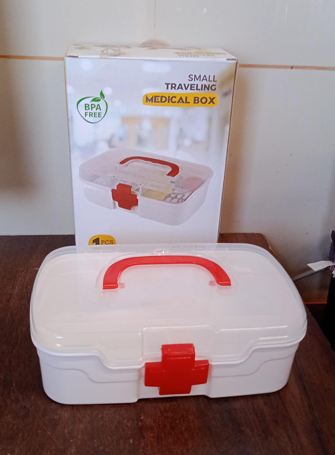 The First Aid Box filled with essential medical supplies like bandages and small bottles.