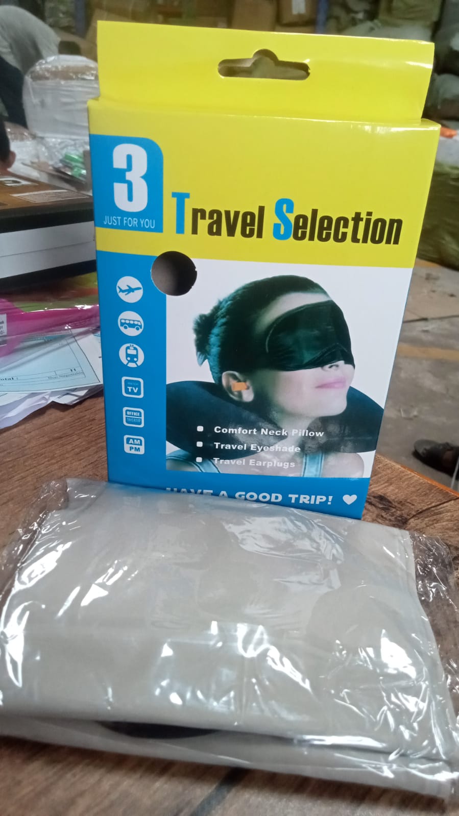 Essential travel set for sleeping peacefully during long journeys with pillow and eye mask.