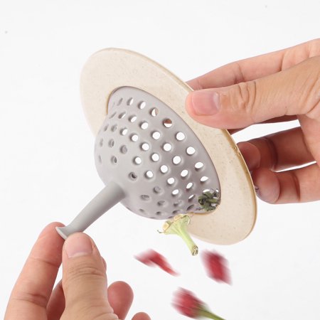 Flexible silicone kitchen sink strainer demonstrating its arched base for stability.
