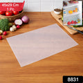 Refrigerator shelf lined with transparent plastic refrigerator mat and organised food items