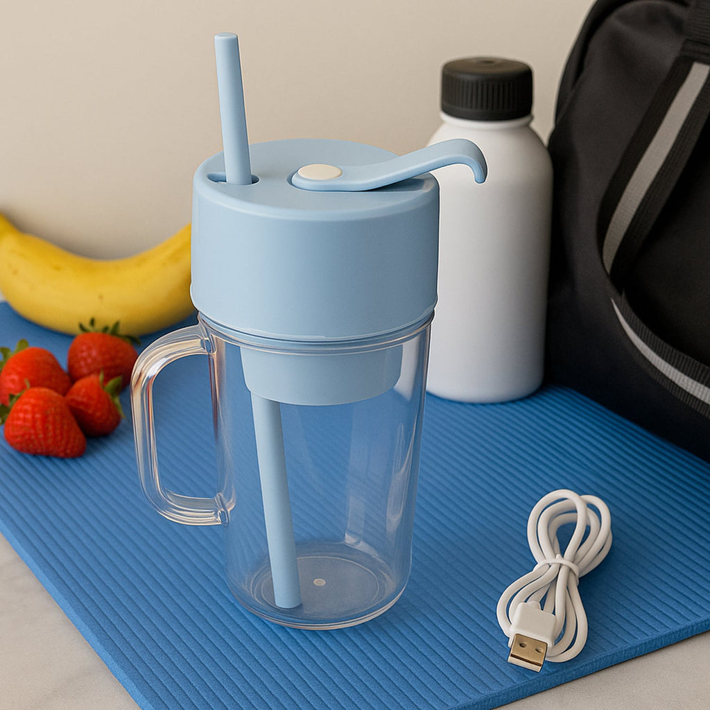 Portable juicer with handle and straw, ready for making fresh juice.