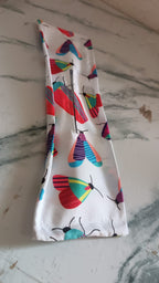 Knotted Wire Headband with an abstract print, displayed neatly on a wooden surface.