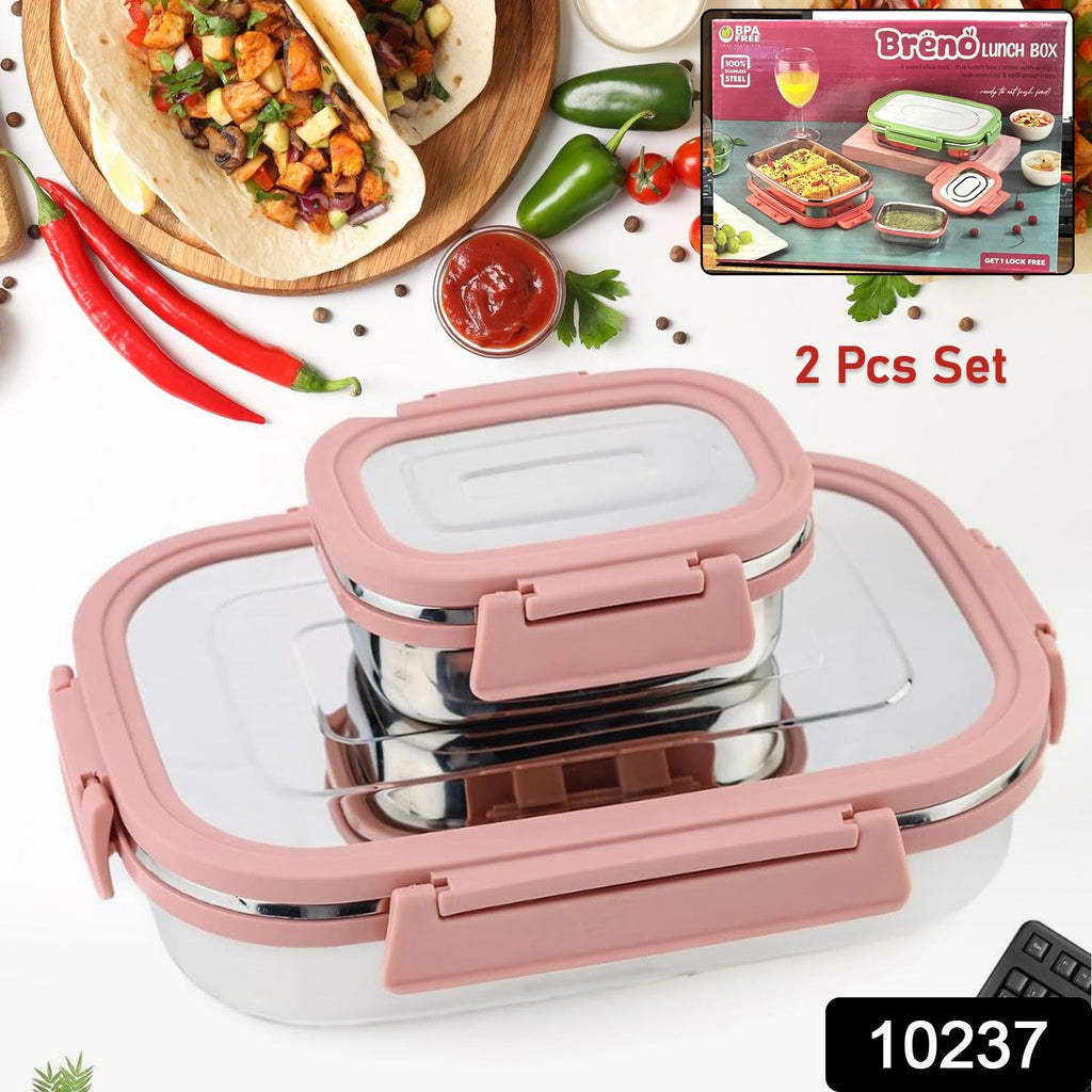 Open stainless steel lunch box with a smaller container for sauces or dips.