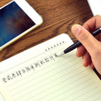The 3-in-1 stylus pen securely holding a smartphone on its integrated mobile stand.