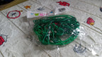 Close-up of the elastic rope material and metal clips.