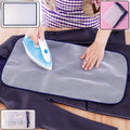 Large mesh ironing press net laid over a garment protecting fabric during ironing