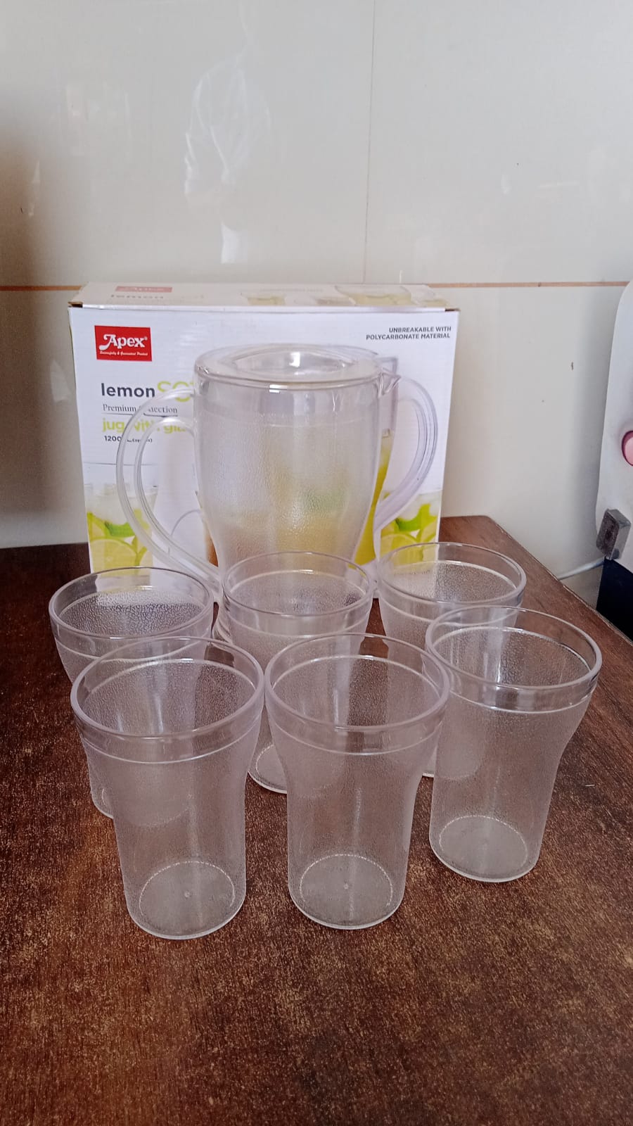Clear polycarbonate beverage jug and glasses set for daily use