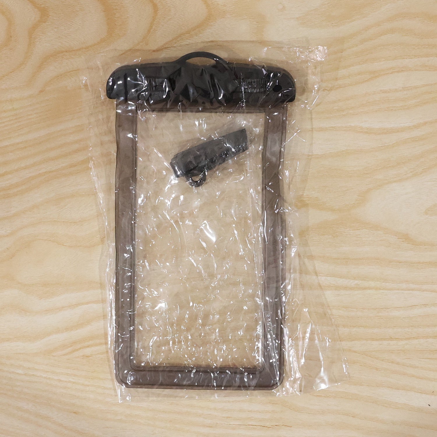 Lifestyle shot of waterproof mobile pouch outdoors