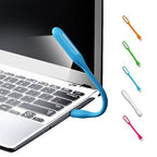 USB LED Light Lamp with a book, highlighting its use for reading.