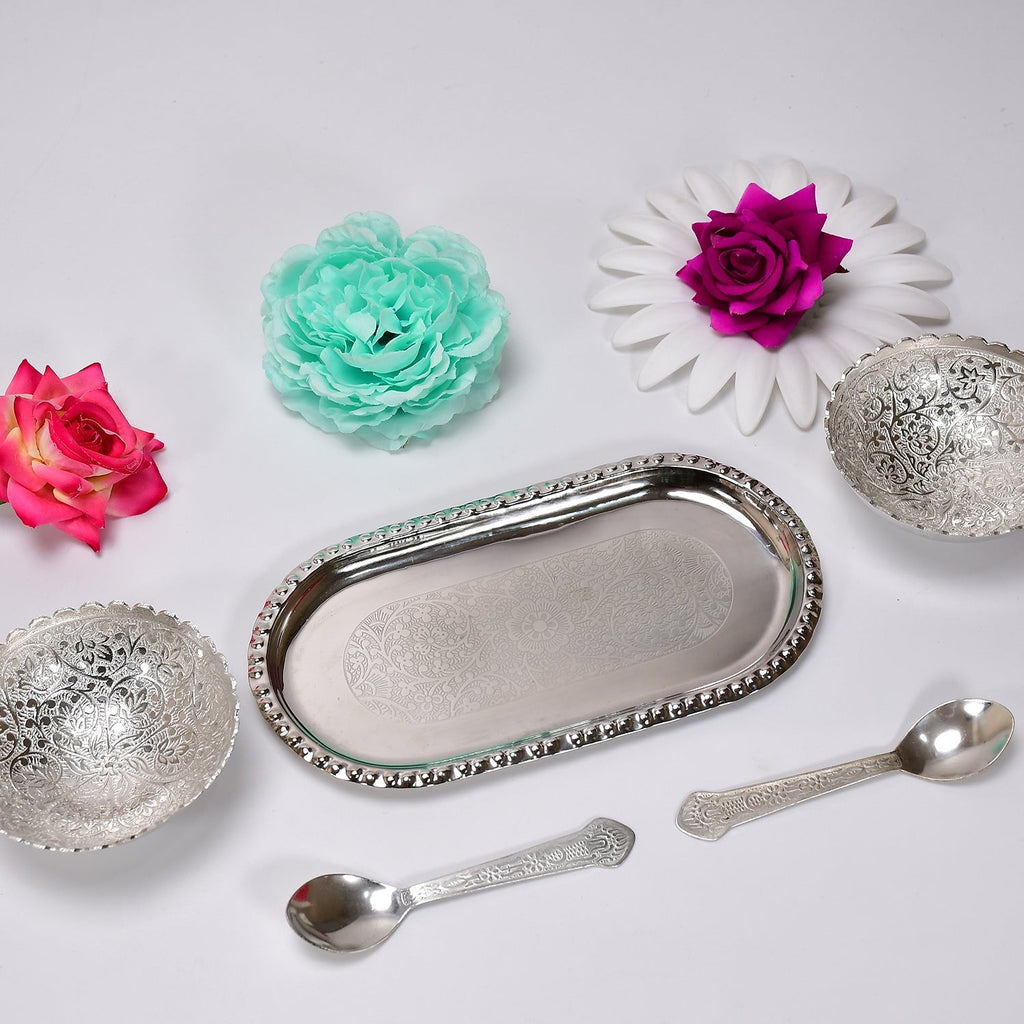A beautiful serving set featuring two silver plated bowls and spoons, designed for traditional Indian hospitality.