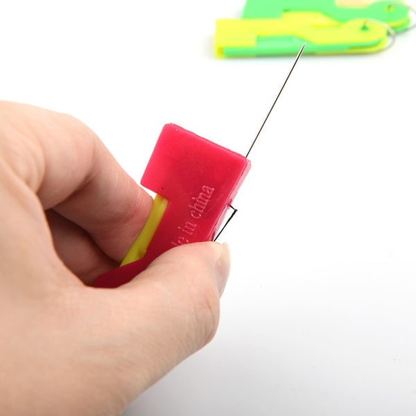 Multicolor automatic needle threader on a clean white background.