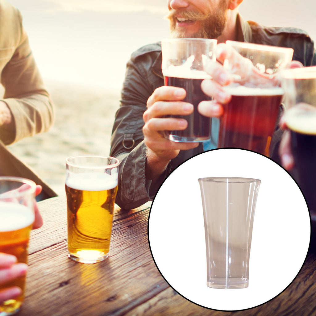 Stylish transparent plastic juice glass set displayed on a kitchen counter.