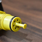 Adjustable brass nozzle of the gold hose sprayer creating a fine mist.