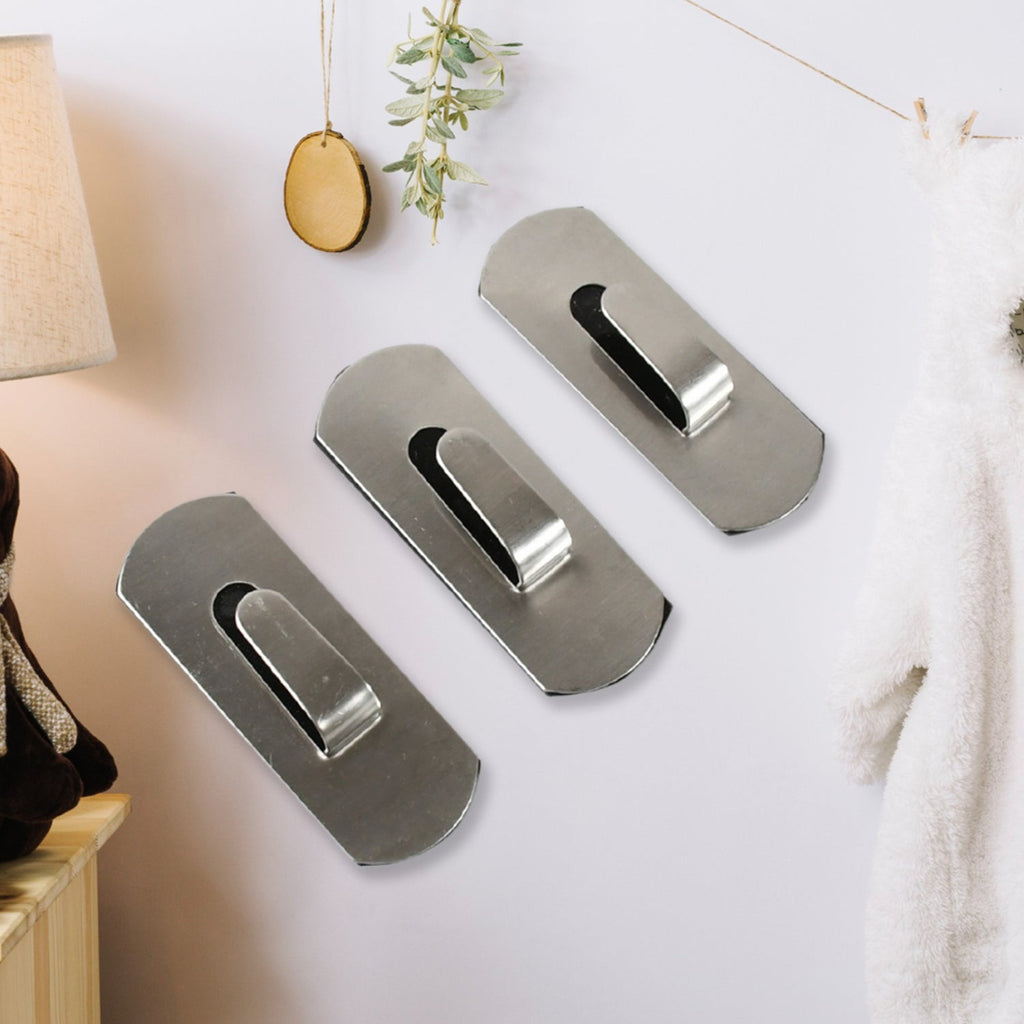 The strong, reusable adhesive backing of a Bathora stainless steel hook for easy installation.