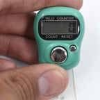 Side view of the portable manual hand counter designed for comfortable grip.