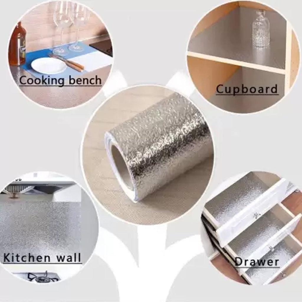 Aluminium foil paper sticker roll being unrolled for application.