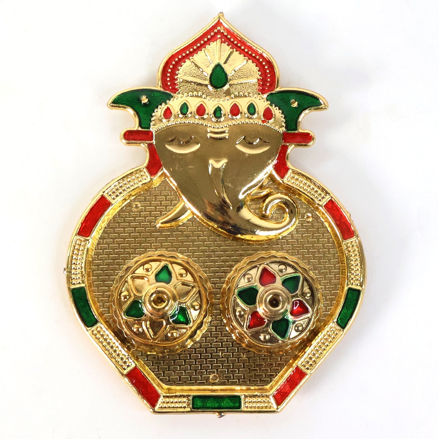 Close-up of golden kumkum container embellished with multicolor stones