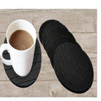 Set of 6 round silicone coasters protecting a table from hot beverages.