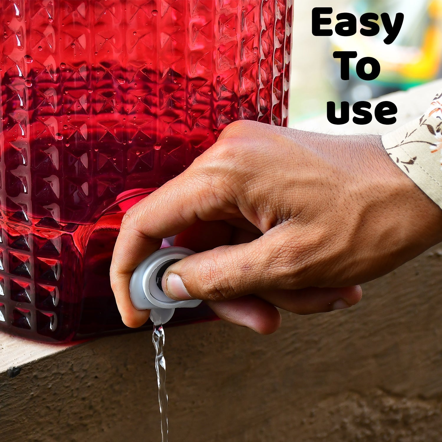 Clear water jug with diamond design for easy pouring and refilling.