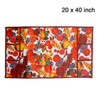 White and maroon fridge top cover adorned with a decorative fruit pattern.