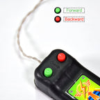 The model racing car displayed next to its lightweight remote control for kids.