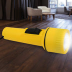 Person holding a portable LED flashlight for easy use.