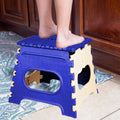 Vibrant multicolor 12 inch folding step stool, open and ready for use.