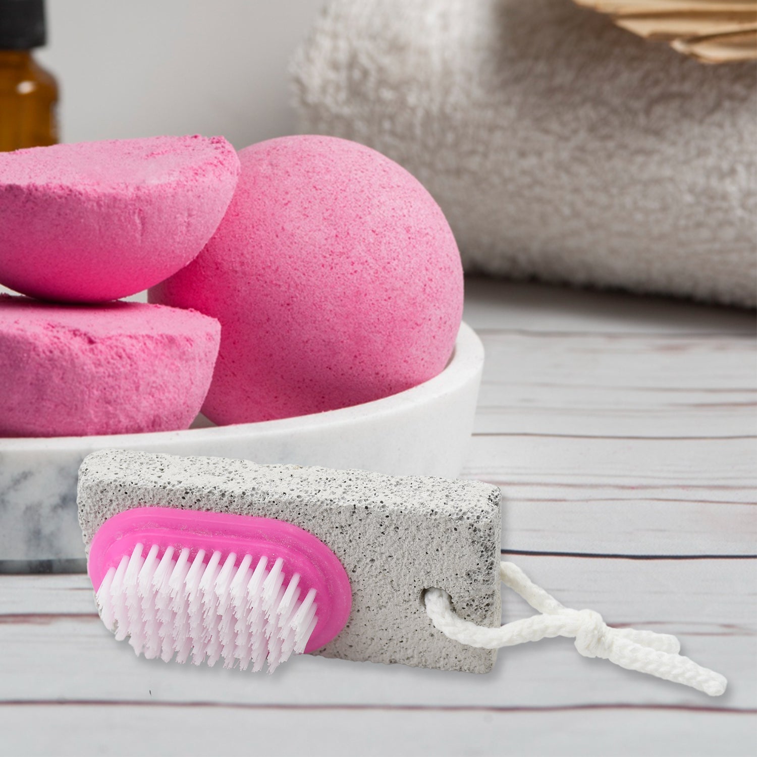 XcelCraft pumice stone foot scrubber with dual-action brush for smooth feet.