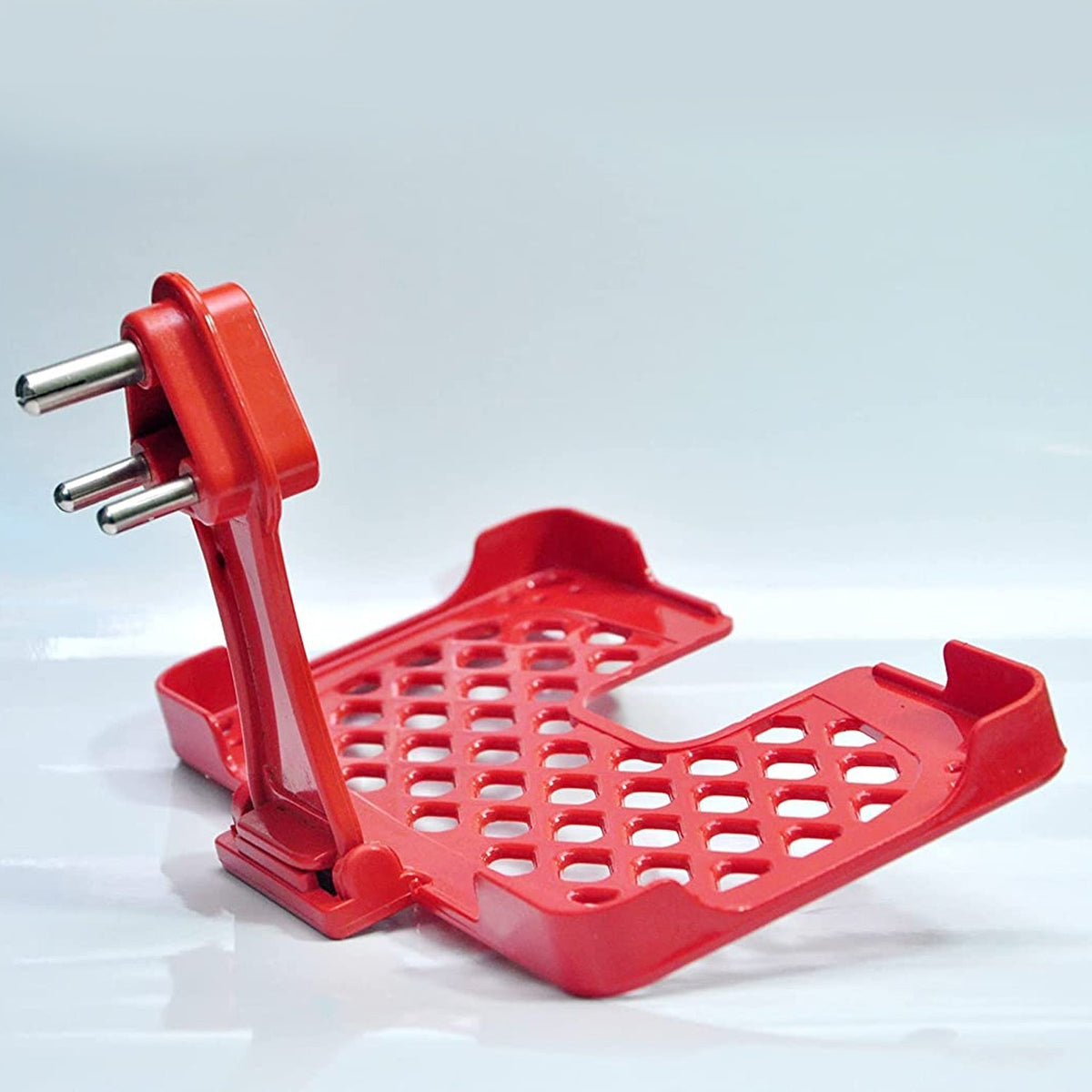 Red mobile charging wall holder mounted on a power socket.