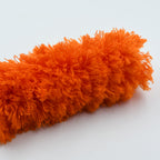Detachable microfiber cleaning head shown removed from the duster handle for washing.