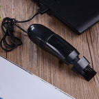 USB mini vacuum cleaner effectively cleaning car interior crevices.