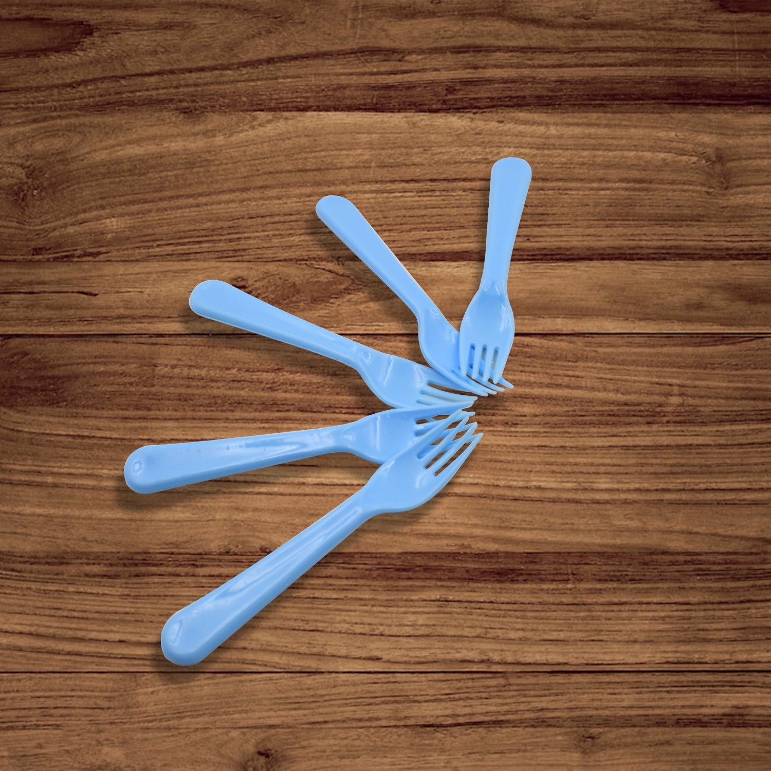 Durable reusable plastic forks, a 5-piece set, ready for various culinary applications.