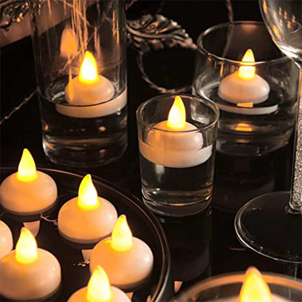 Set of 8 flameless floating candles for decorative lighting.