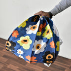 Children's toys neatly stored inside the Organivo canvas laundry bag.