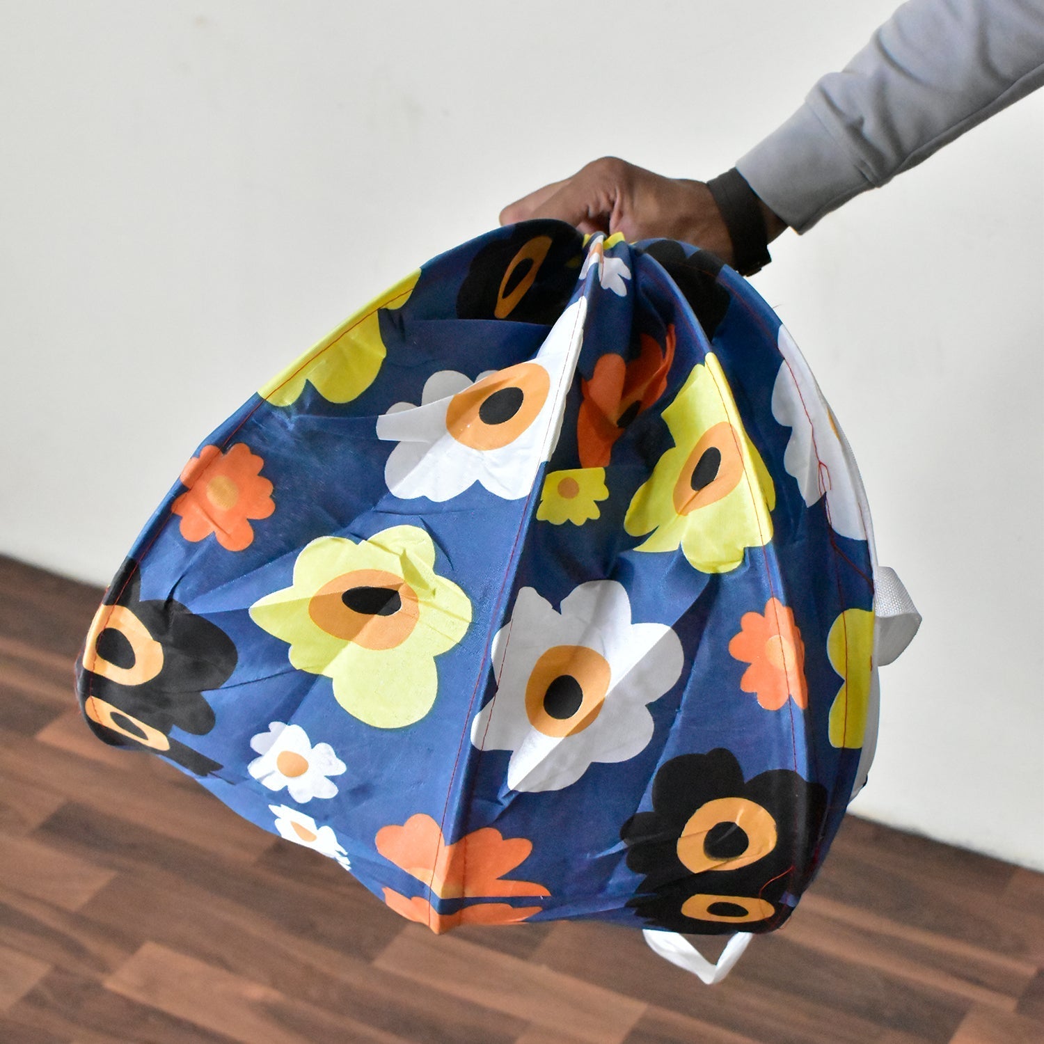 Children's toys neatly stored inside the Organivo canvas laundry bag.