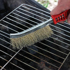 Stainless steel wire brush with ergonomic handle, ideal for rust removal.