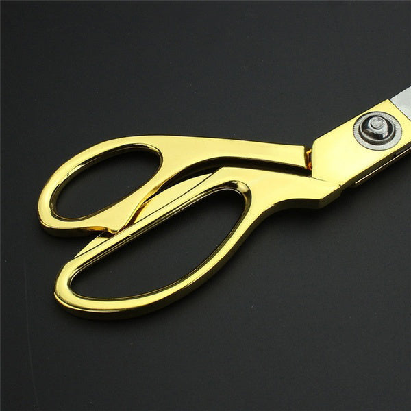 Durable gold-plated cloth cutting scissors demonstrating their robust construction.