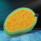 Versatile Mango Dish Sponge tackling tough stains on a kitchen counter.
