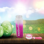 Stylish colorful glass water bottle captured in a vibrant lifestyle setting.