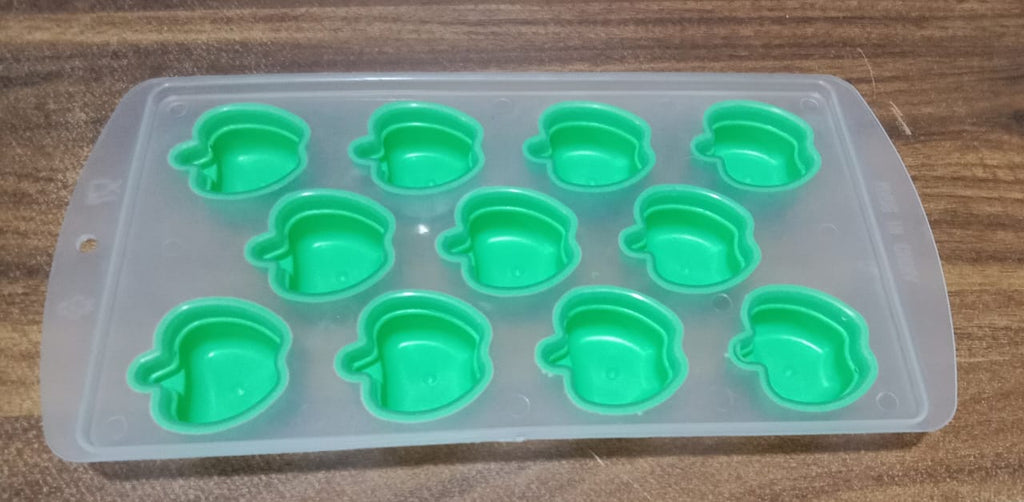 Refreshingly cool fruit-shaped ice cubes floating in a drink.