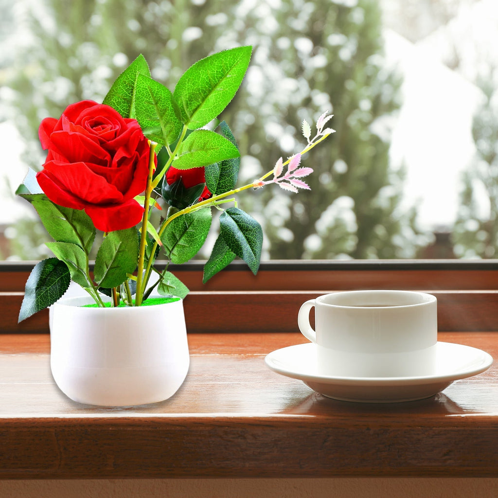 Vibrant red artificial rose plant in a decorative pot, perfect for home decor.