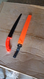 Effective use of the hand pruning saw for efficient branch cutting in a garden.