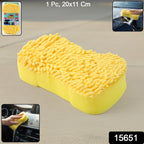 Hand holding microfiber sponge for vehicle cleaning