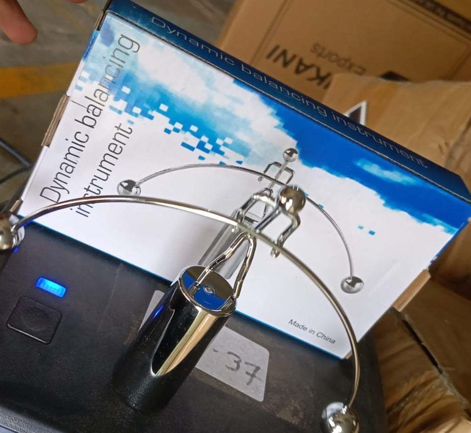 The metal pendulum balance toy, ideal for both educational display and office decor.