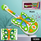 Close-up of the light-up butterfly guitar toy with musical notes.