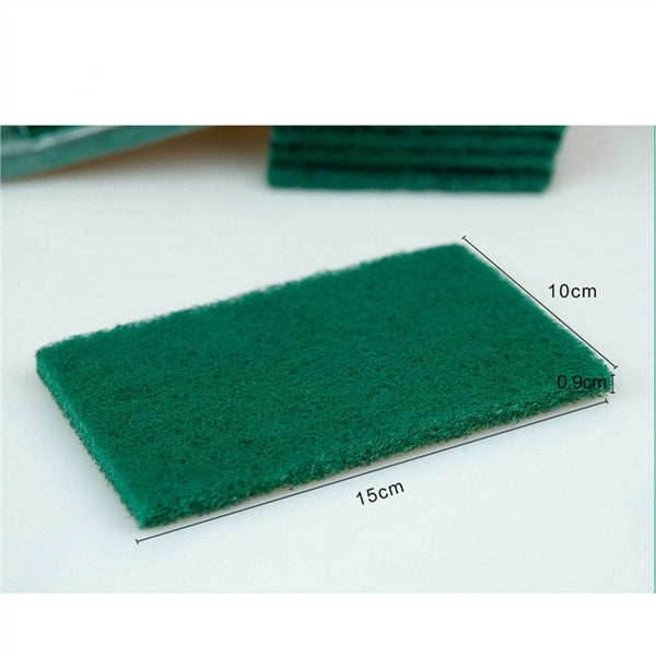 Multiple green kitchen scrubber pads arranged, highlighting their 10-pack value for household cleaning.