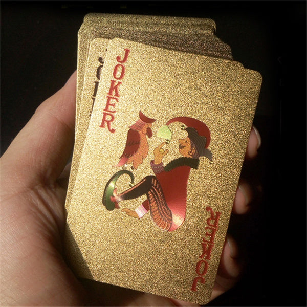 Set of gold-plated playing cards fanned out, ideal for a luxury poker night.